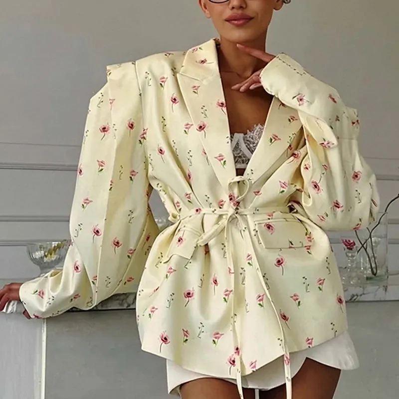 Polyester suit jacket with an adjustable lace-up collar at the waist, shown in a floral print colour option.