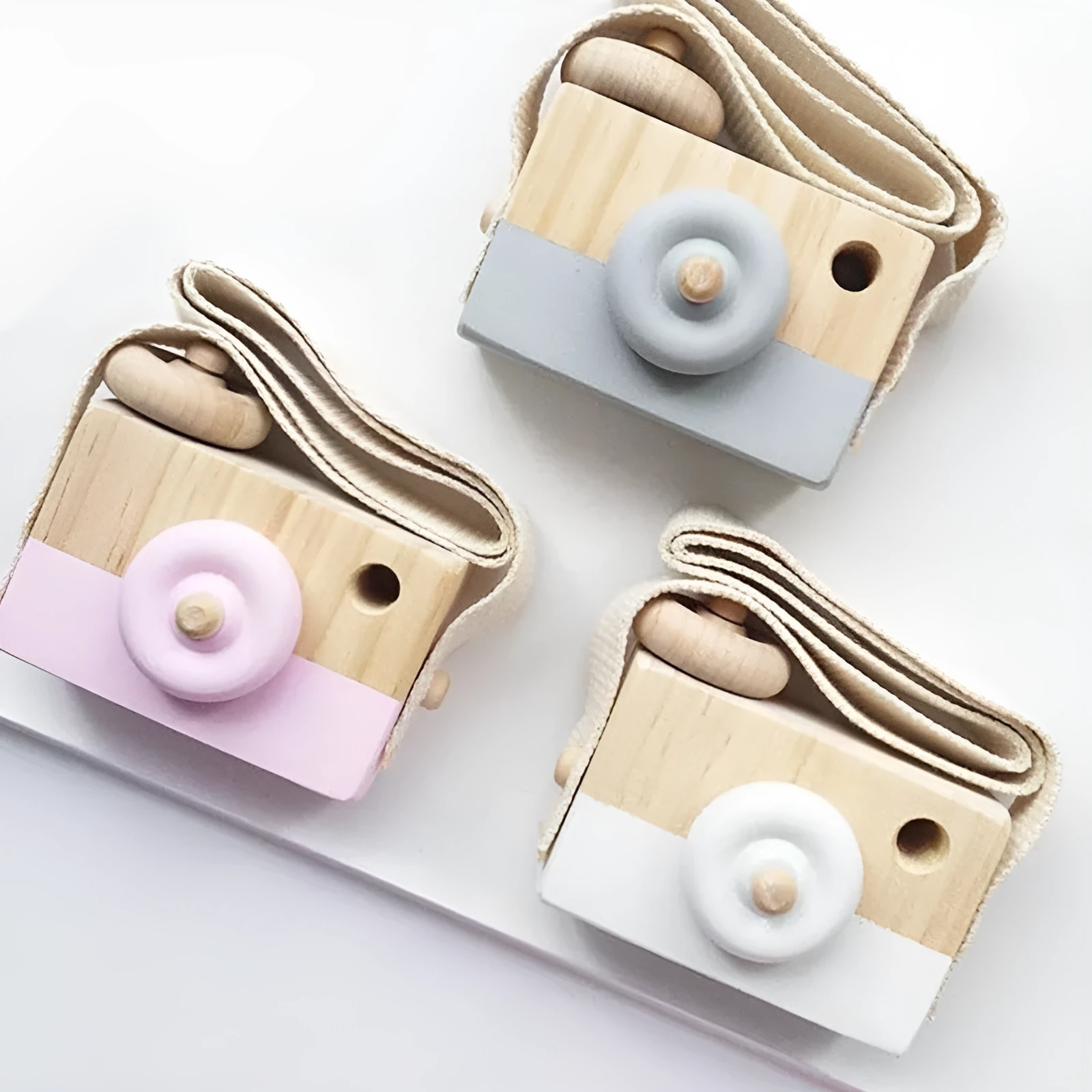 Wooden camera toy for kids in seven colours, unisex design, pivotable round part