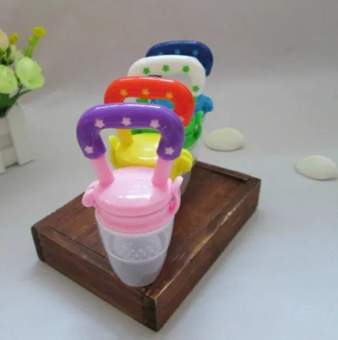 New baby silicone pacifier encapsulated food feeder in size M with blue silicone nipple