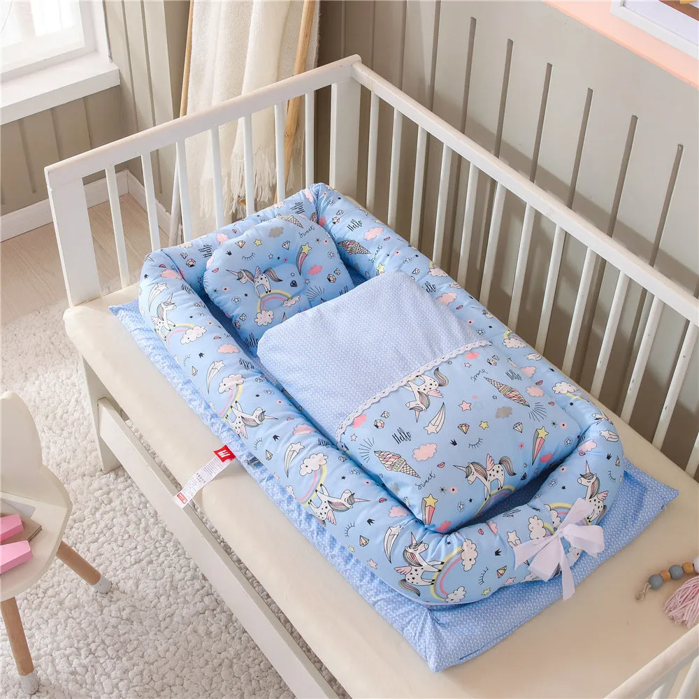 Portable foldable newborn crib with bionic mattress, cotton cover, and quilt in feather white style