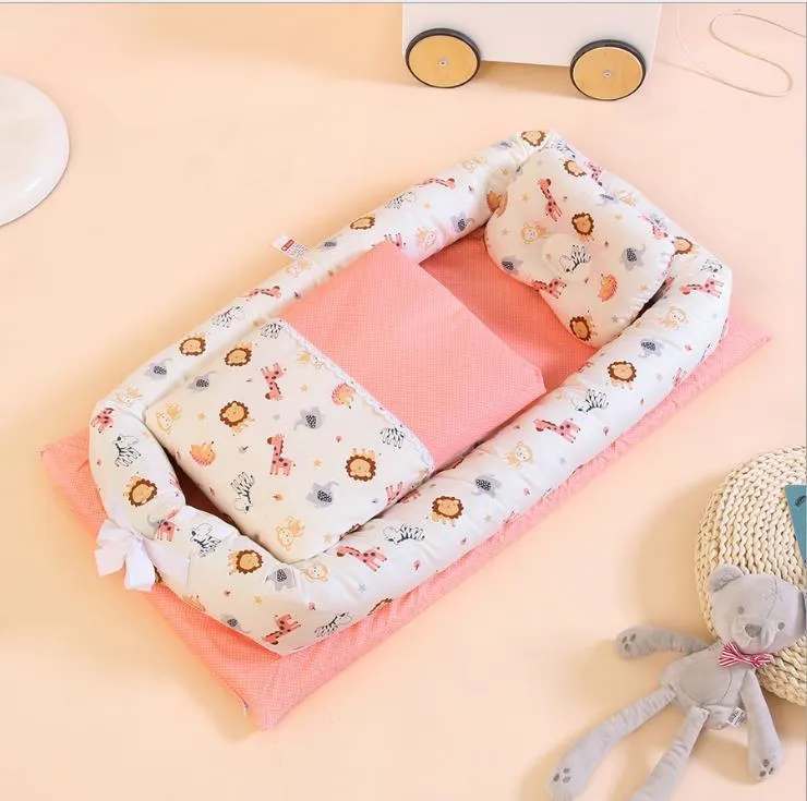 Portable foldable newborn crib with bionic mattress, cotton cover, and quilt in feather white style