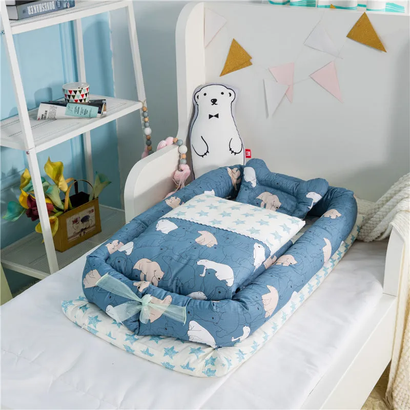 Portable foldable newborn crib with bionic mattress, cotton cover, and quilt in feather white style