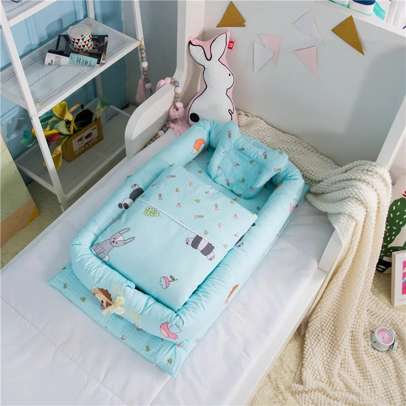 Portable foldable newborn crib with bionic mattress, cotton cover, and quilt in feather white style