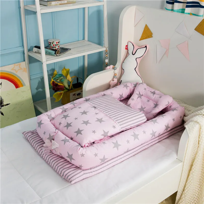 Portable foldable newborn crib with bionic mattress, cotton cover, and quilt in feather white style