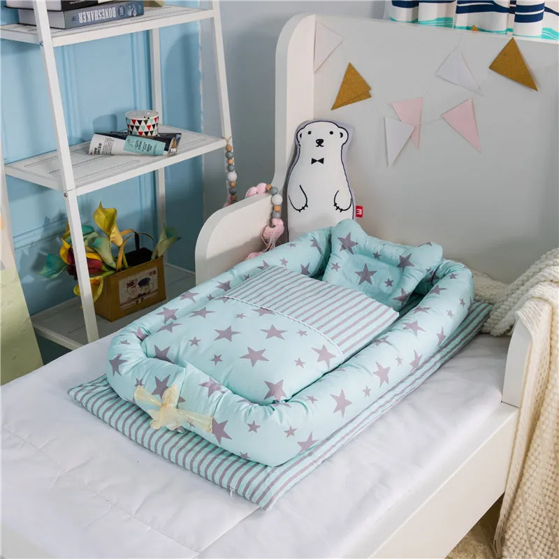 Portable foldable newborn crib with bionic mattress, cotton cover, and quilt in feather white style