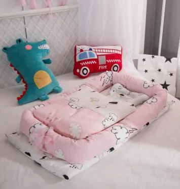 Portable foldable newborn crib with bionic mattress, cotton cover, and quilt in feather white style