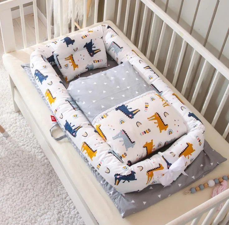 Portable foldable newborn crib with bionic mattress, cotton cover, and quilt in feather white style