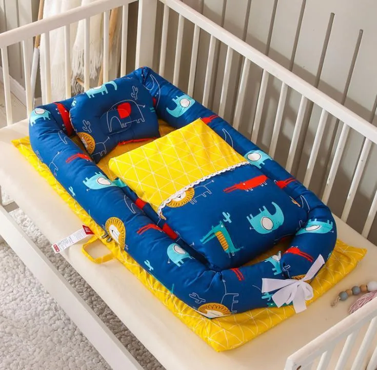 Portable foldable newborn crib with bionic mattress, cotton cover, and quilt in feather white style
