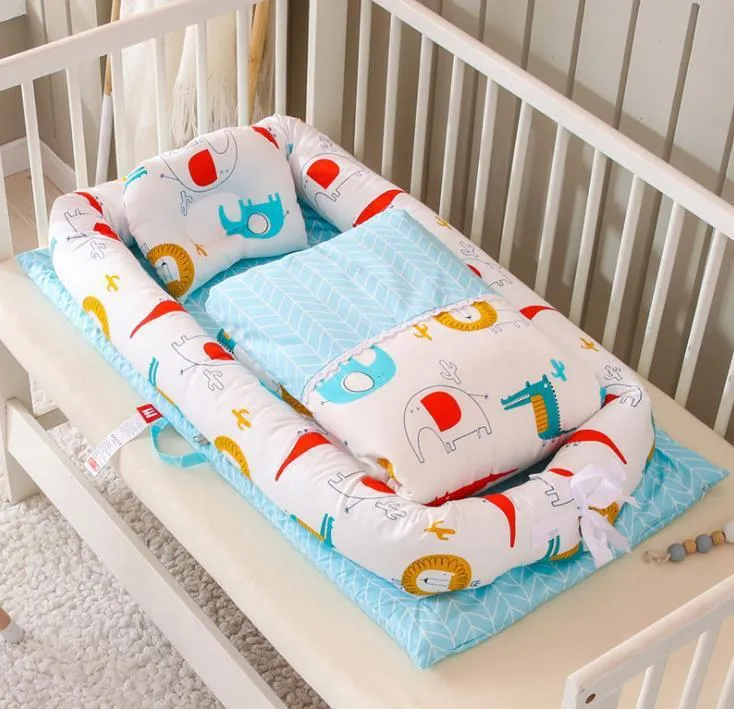 Portable foldable newborn crib with bionic mattress, cotton cover, and quilt in feather white style