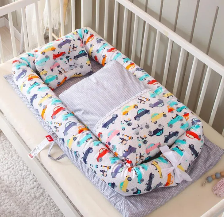 Portable foldable newborn crib with bionic mattress, cotton cover, and quilt in feather white style