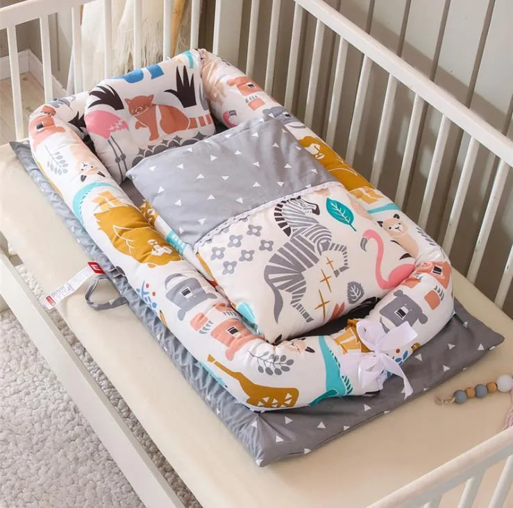 Portable foldable newborn crib with bionic mattress, cotton cover, and quilt in feather white style