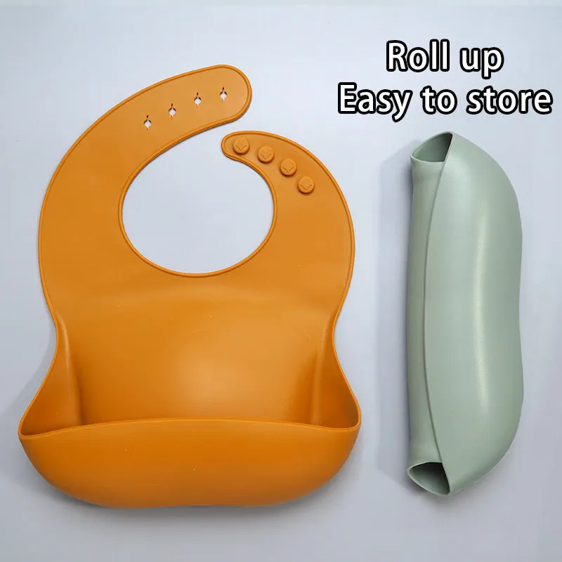 Soft waterproof silicone baby bib with food catcher in pink, with adjustable neck closure