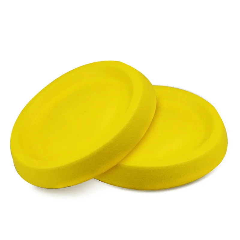 Yellow lightweight EVA dog throwing toy on grass for outdoor fetch play
