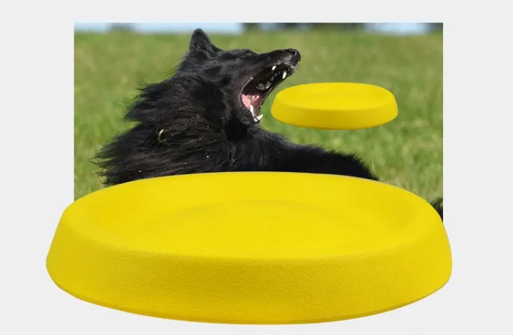 Yellow lightweight EVA dog throwing toy on grass for outdoor fetch play