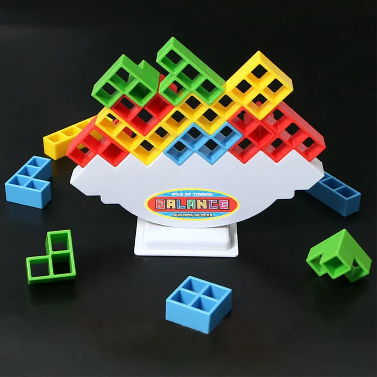 Balance stacking board game with 16 plastic coloured building blocks, base and chassis on a flat surface