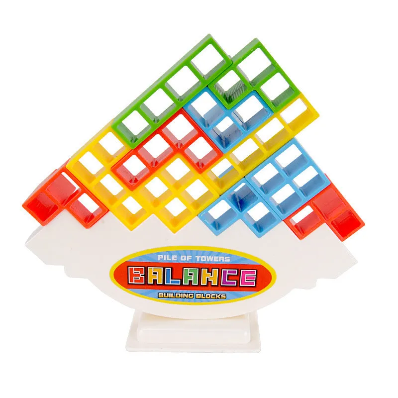 Balance stacking board game with 16 plastic coloured building blocks, base and chassis on a flat surface