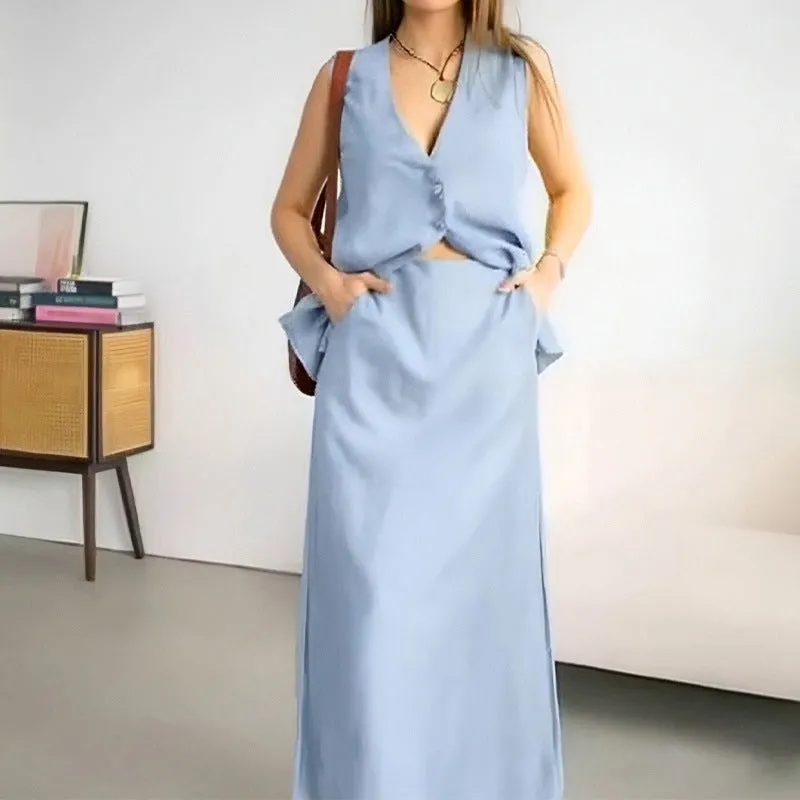 Blue casual sleeveless vest and long skirt two-piece set on a hanger.