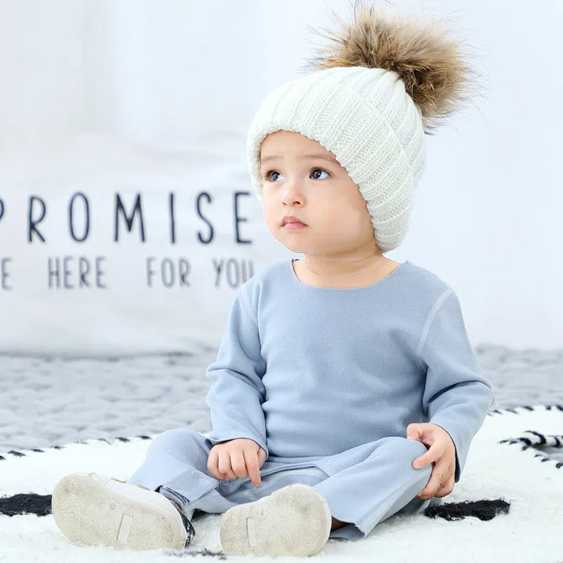 Baby pajama climbing suit in 100% polyester with blue colour, footed Siamese style, on white background