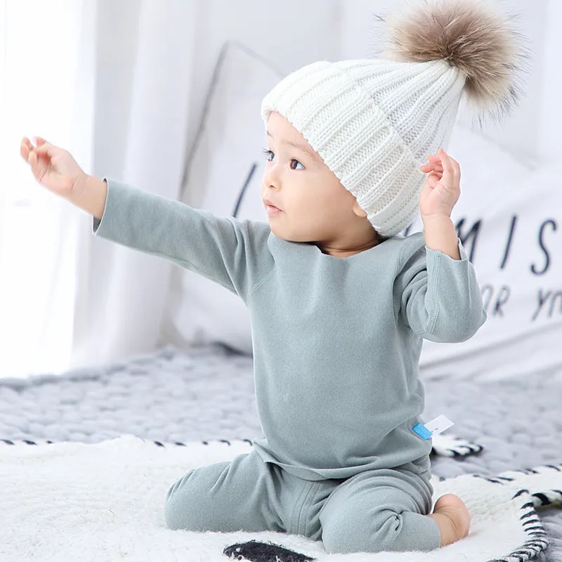 Baby pajama climbing suit in 100% polyester with blue colour, footed Siamese style, on white background