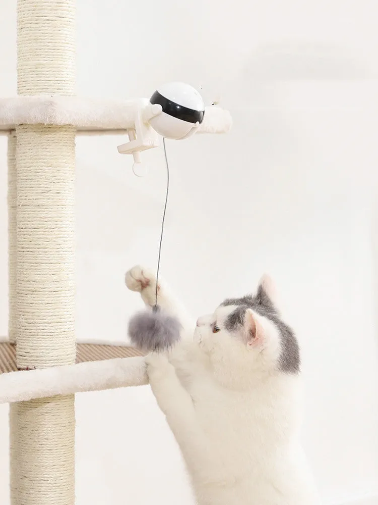 Electric automatic lifting cat toy with rabbit hair teaser and black ABS body on a light floor
