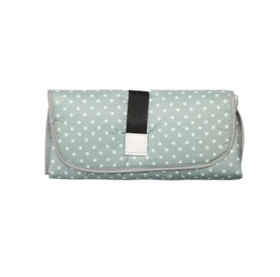 Portable baby diaper changing mat in yellow geometric pattern, 70x50cm, with toy ring and wrist strap unfolded on floor