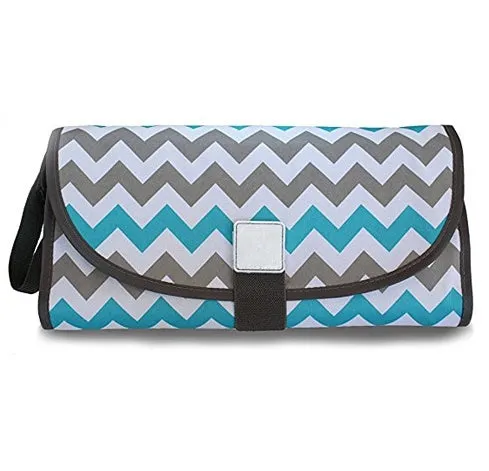 Portable baby diaper changing mat in yellow geometric pattern, 70x50cm, with toy ring and wrist strap unfolded on floor