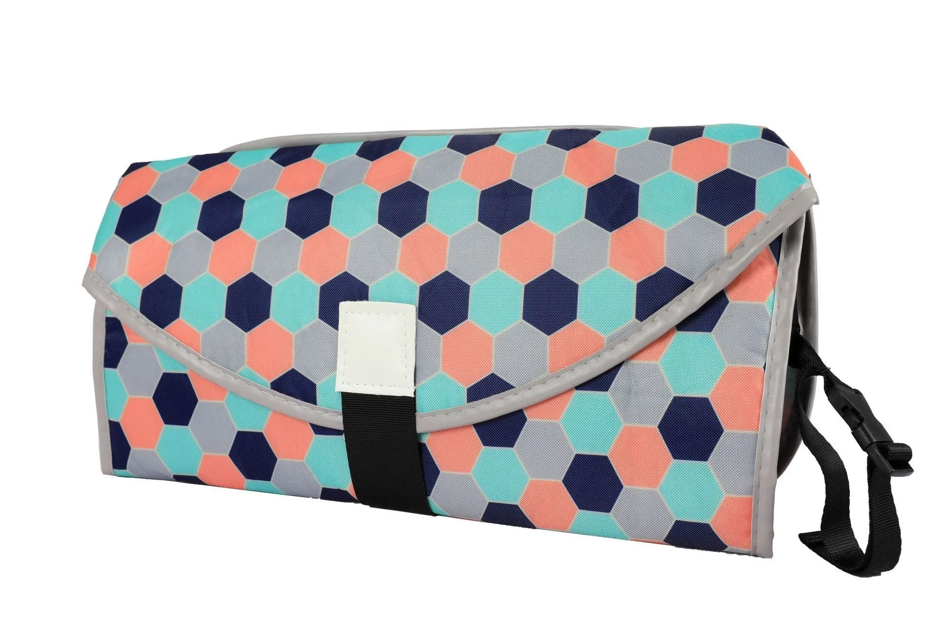 Portable baby diaper changing mat in yellow geometric pattern, 70x50cm, with toy ring and wrist strap unfolded on floor