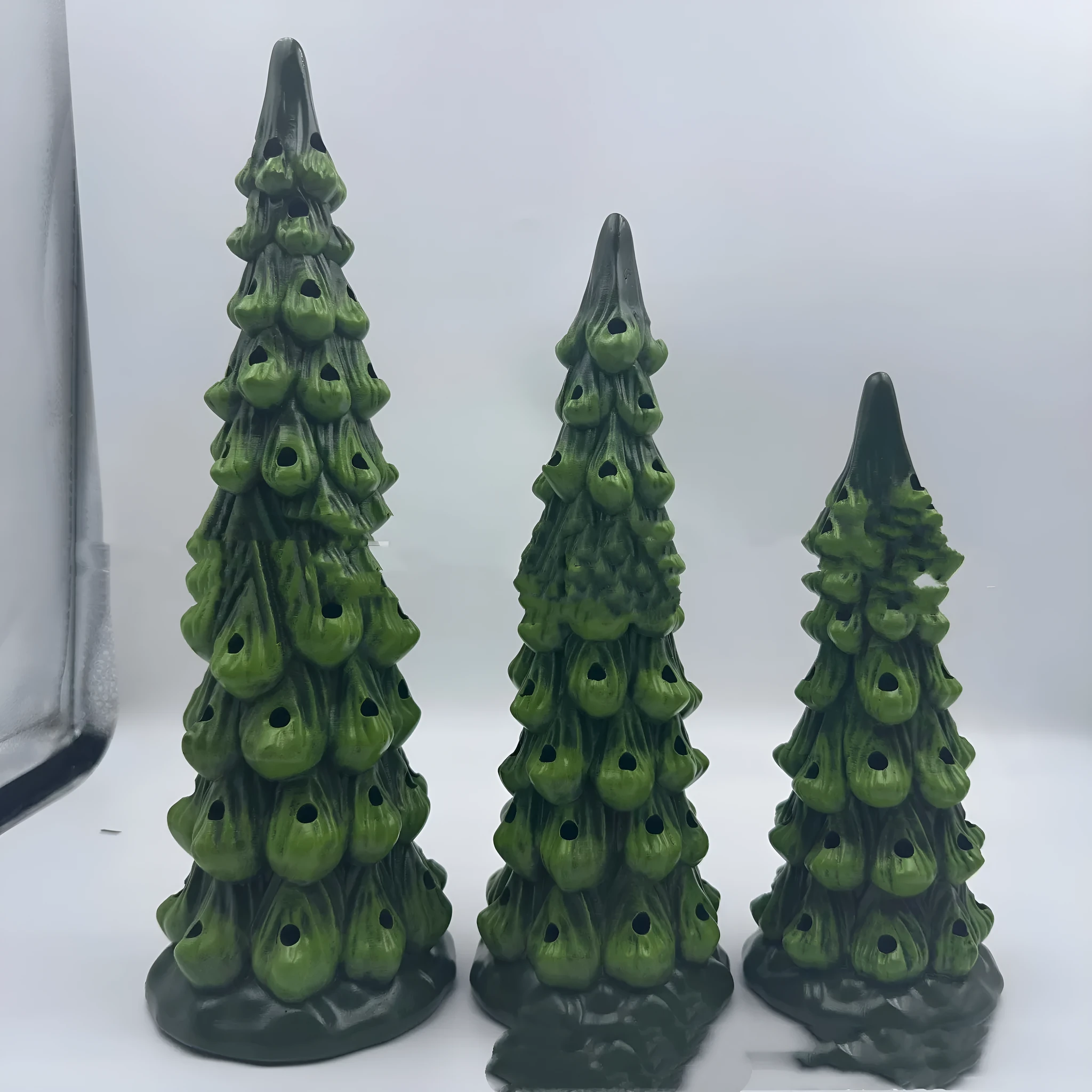 Set of three white resin Christmas tree lamp ornaments in 20cm, 25cm, and 30cm sizes with LED lights.
