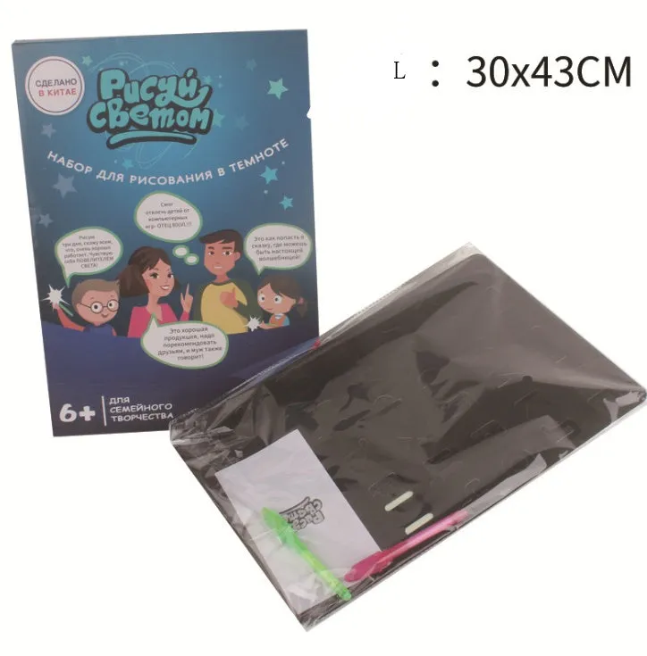 Educational drawing pad with light-accumulating coating, flashlight marker, and alphabet template for children aged 4-6.