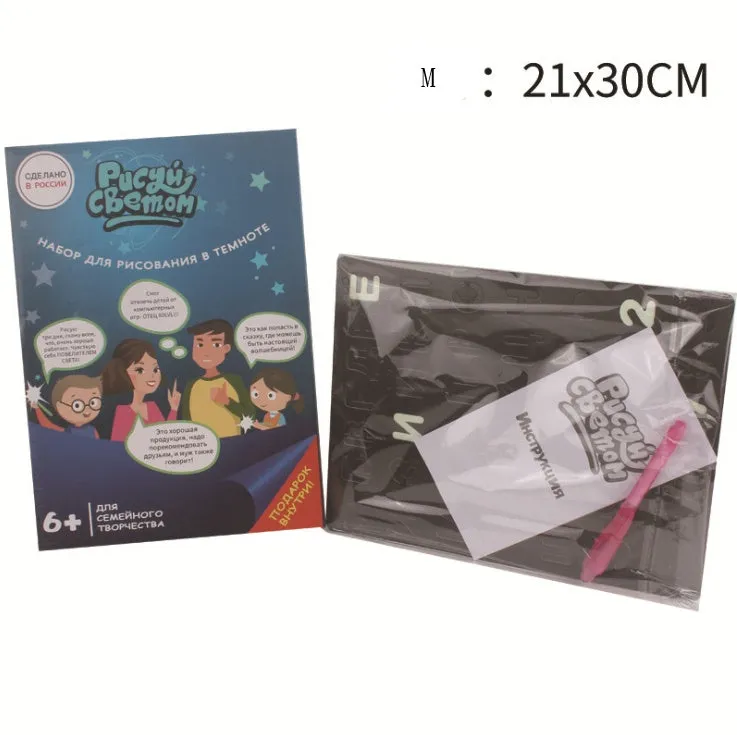 Educational drawing pad with light-accumulating coating, flashlight marker, and alphabet template for children aged 4-6.