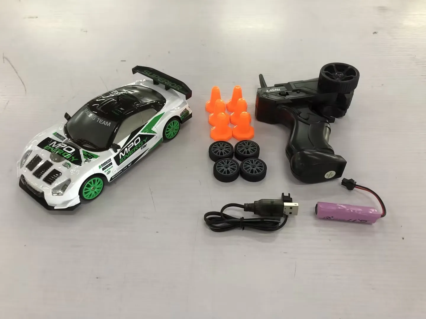 2.4G RC drift car 4WD 1:24 scale remote control toy GTR model in classic style on road with traffic cones