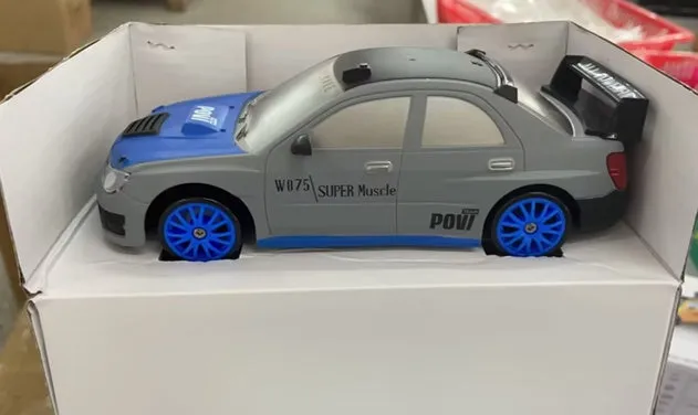 2.4G RC drift car 4WD 1:24 scale remote control toy GTR model in classic style on road with traffic cones