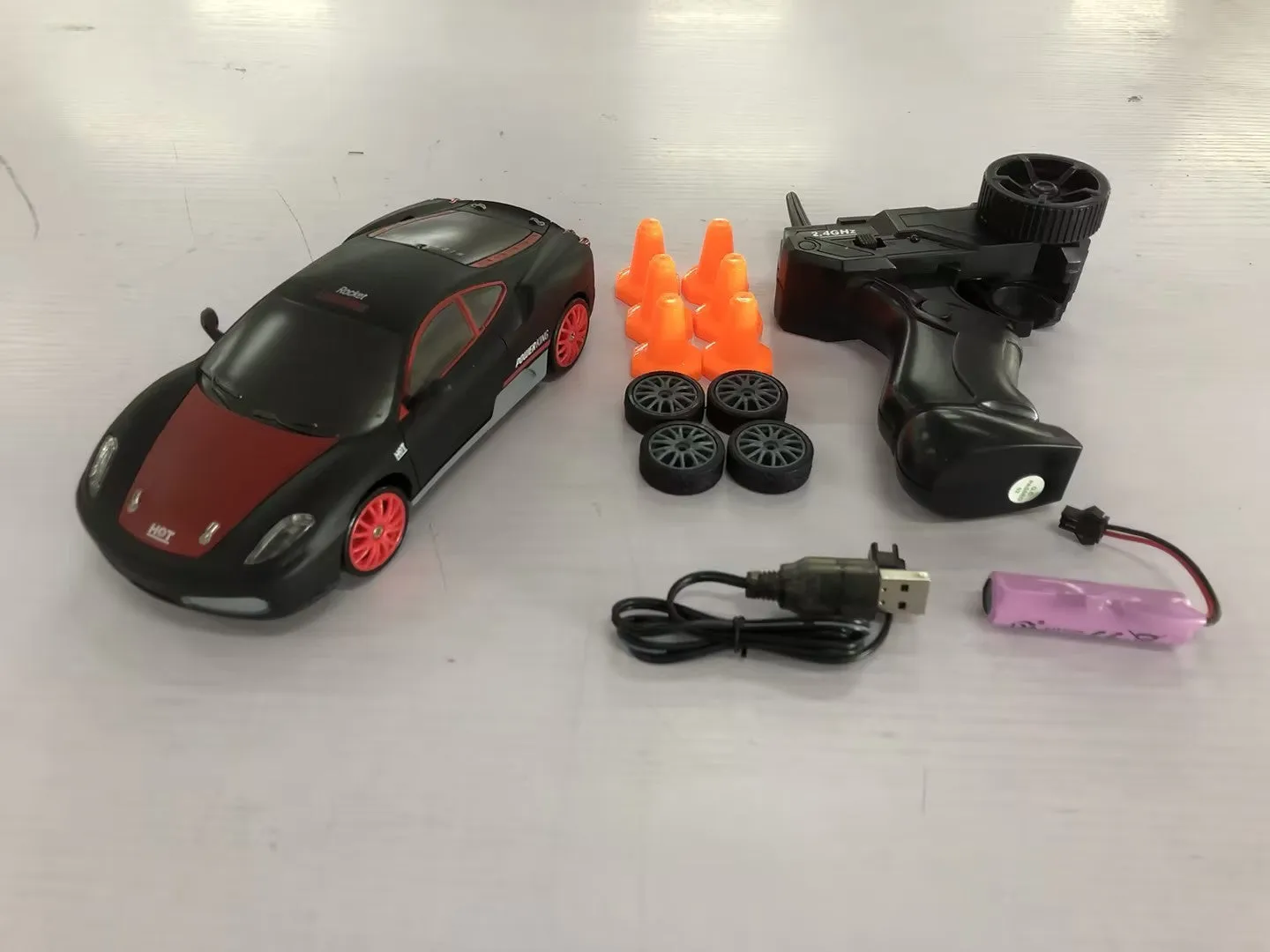 2.4G RC drift car 4WD 1:24 scale remote control toy GTR model in classic style on road with traffic cones