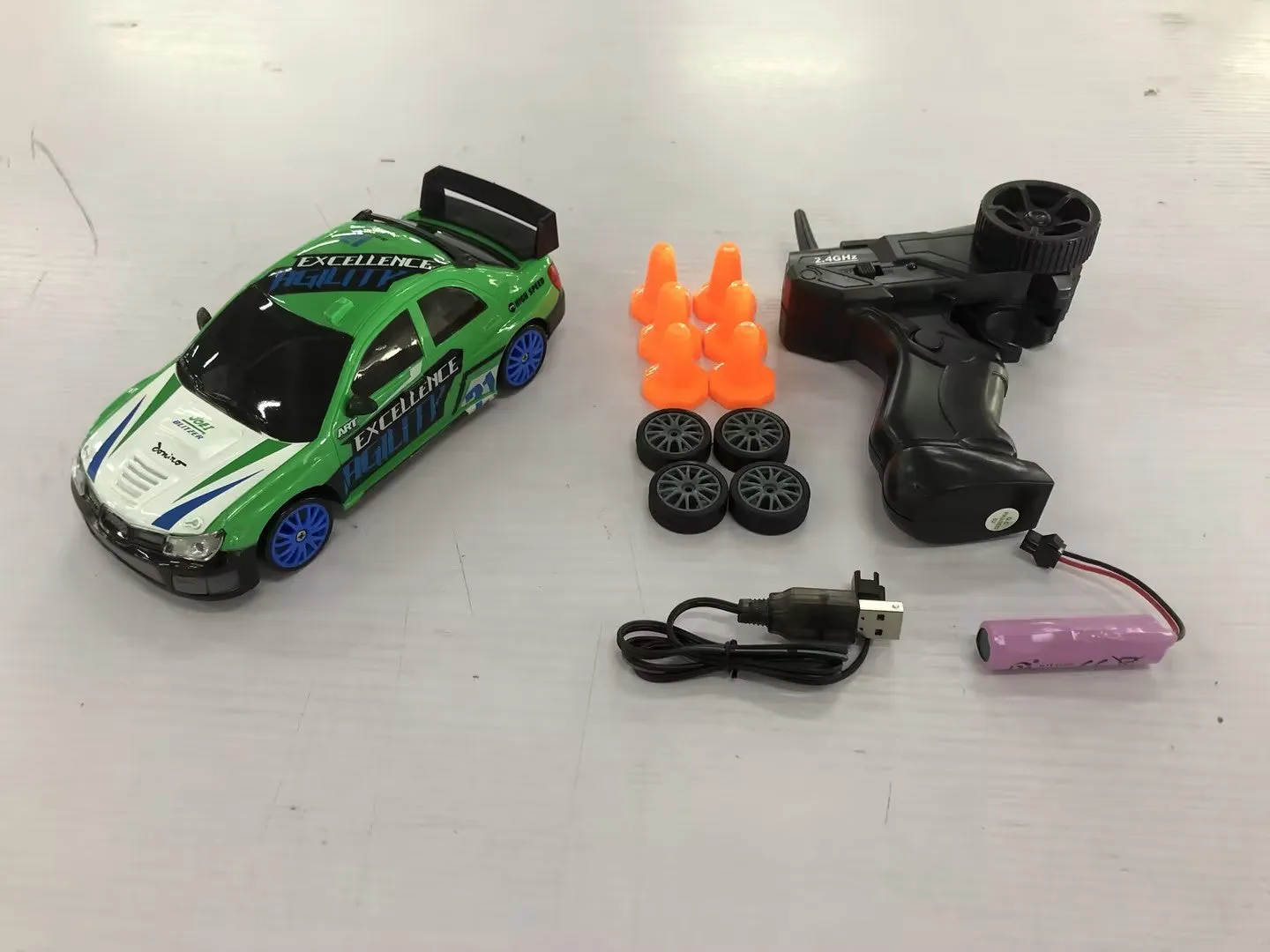 2.4G RC drift car 4WD 1:24 scale remote control toy GTR model in classic style on road with traffic cones