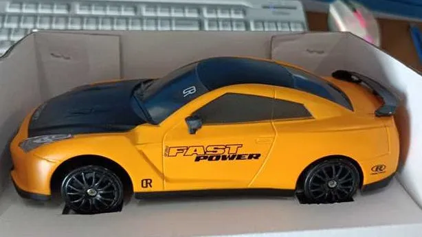 2.4G RC drift car 4WD 1:24 scale remote control toy GTR model in classic style on road with traffic cones