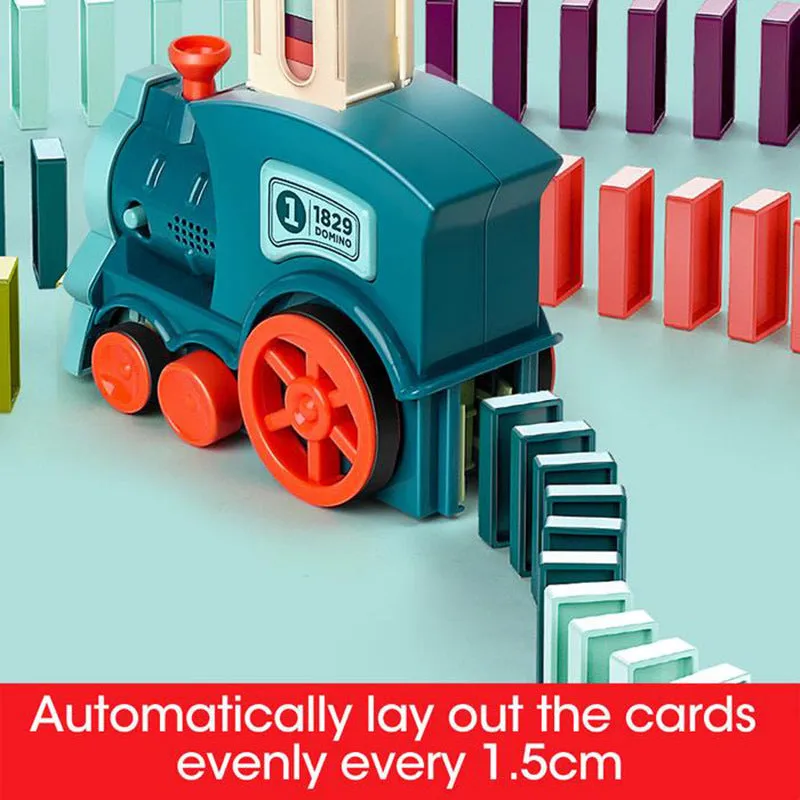 Domino train toy with 100 plastic dominoes in random colours, including toy train and card storage box