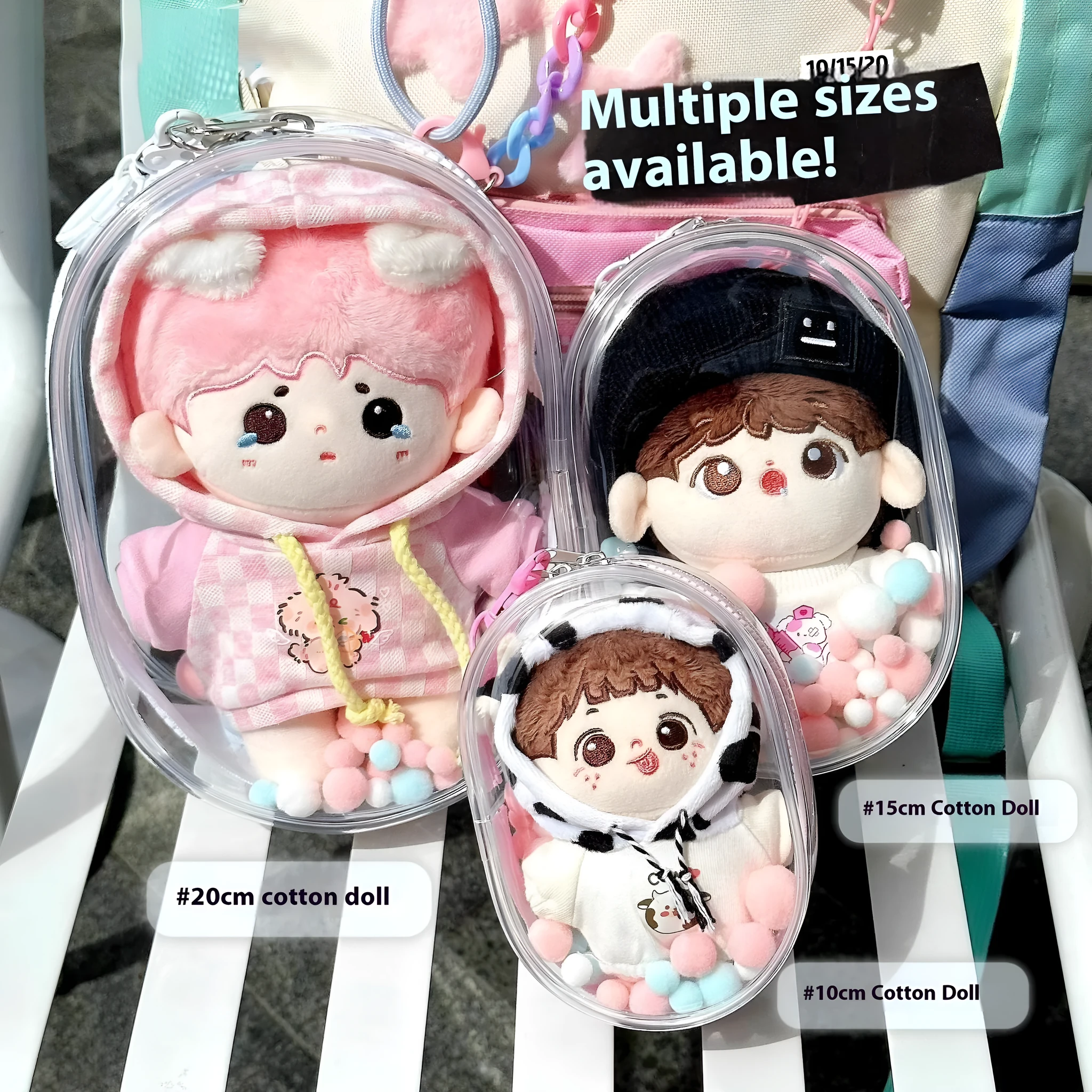 Transparent PVC cube storage bag for cotton dolls with keychain attachment.