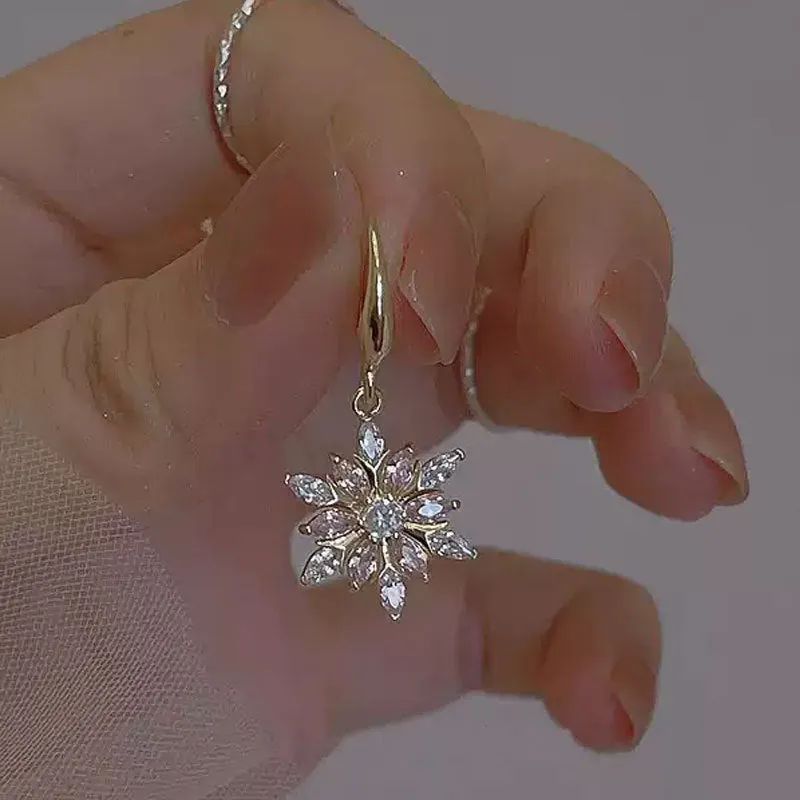 Gold snowflake earrings with zircon stones on alloy base, geometric design for women