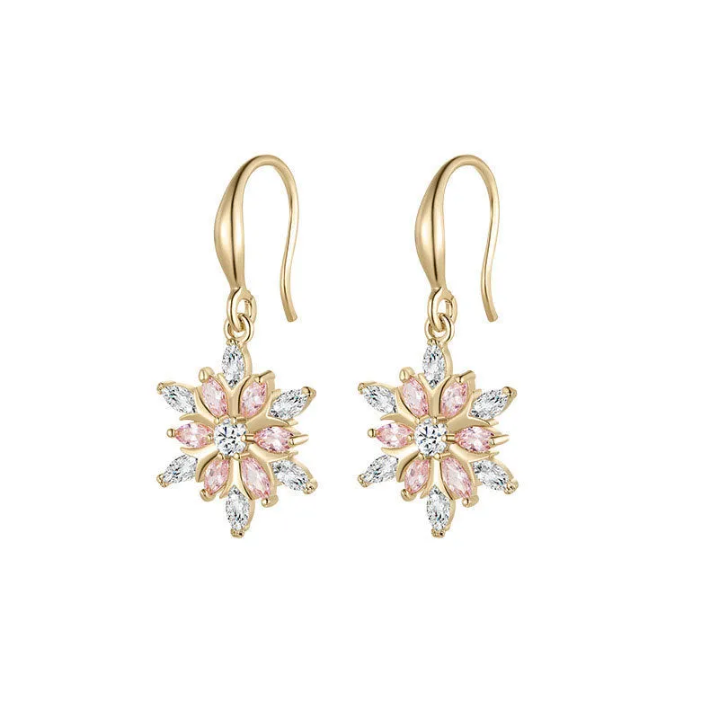 Gold snowflake earrings with zircon stones on alloy base, geometric design for women