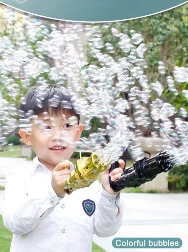 Children's ABS plastic bubble gun machine in pink with trigger and bubble head, used as a toy for outdoor parties