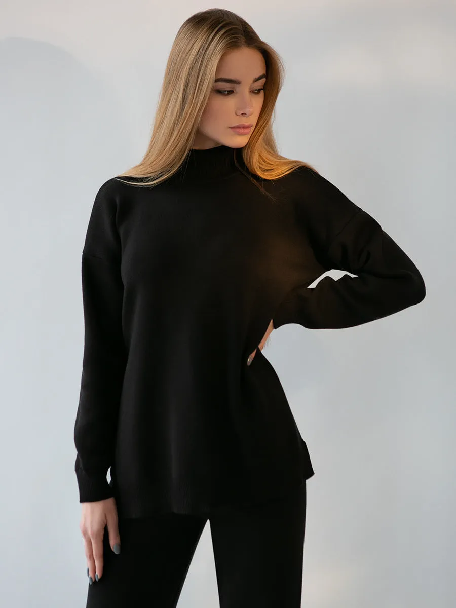Women's turtleneck knit sweater suit set in solid colour with long sleeves and matching trousers on display