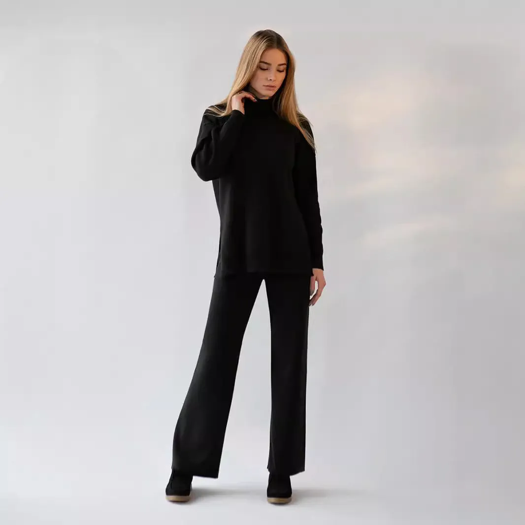 Women's turtleneck knit sweater suit set in solid colour with long sleeves and matching trousers on display