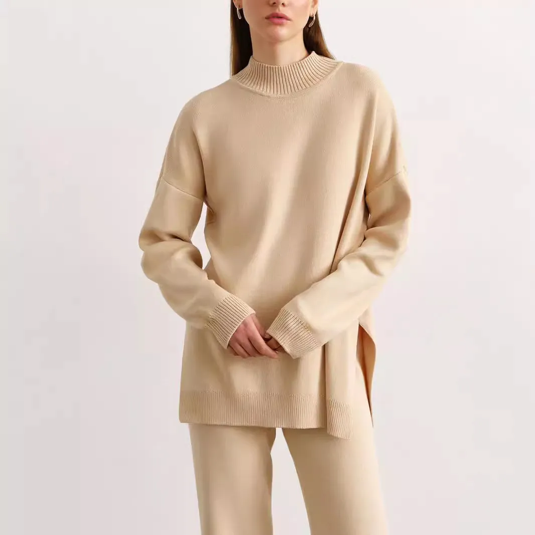 Women's turtleneck knit sweater suit set in solid colour with long sleeves and matching trousers on display