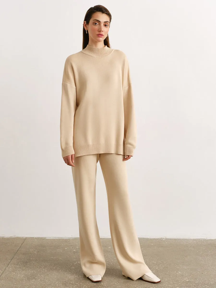 Women's turtleneck knit sweater suit set in solid colour with long sleeves and matching trousers on display