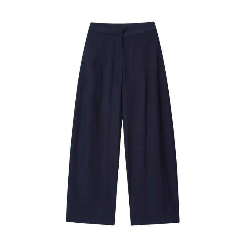 Women's linen blend wide-leg trouser and flounced sleeve top co-ord suit set in a professional style.