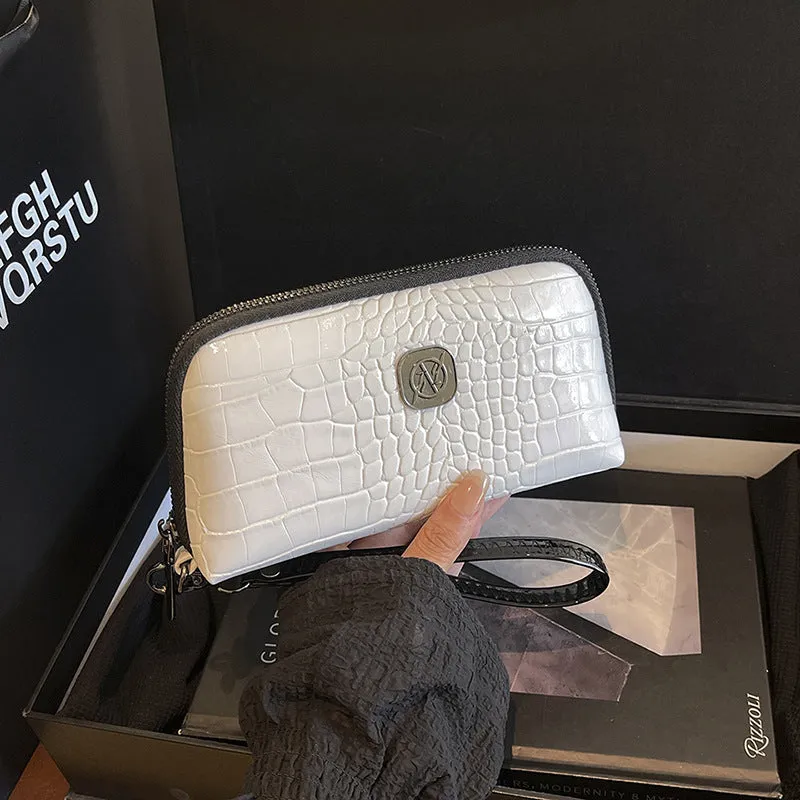 Hand-held Crystal Bamboo Pattern mobile phone bag in black, rectangular shape, 19x5x10cm, PU material, with interior pockets.
