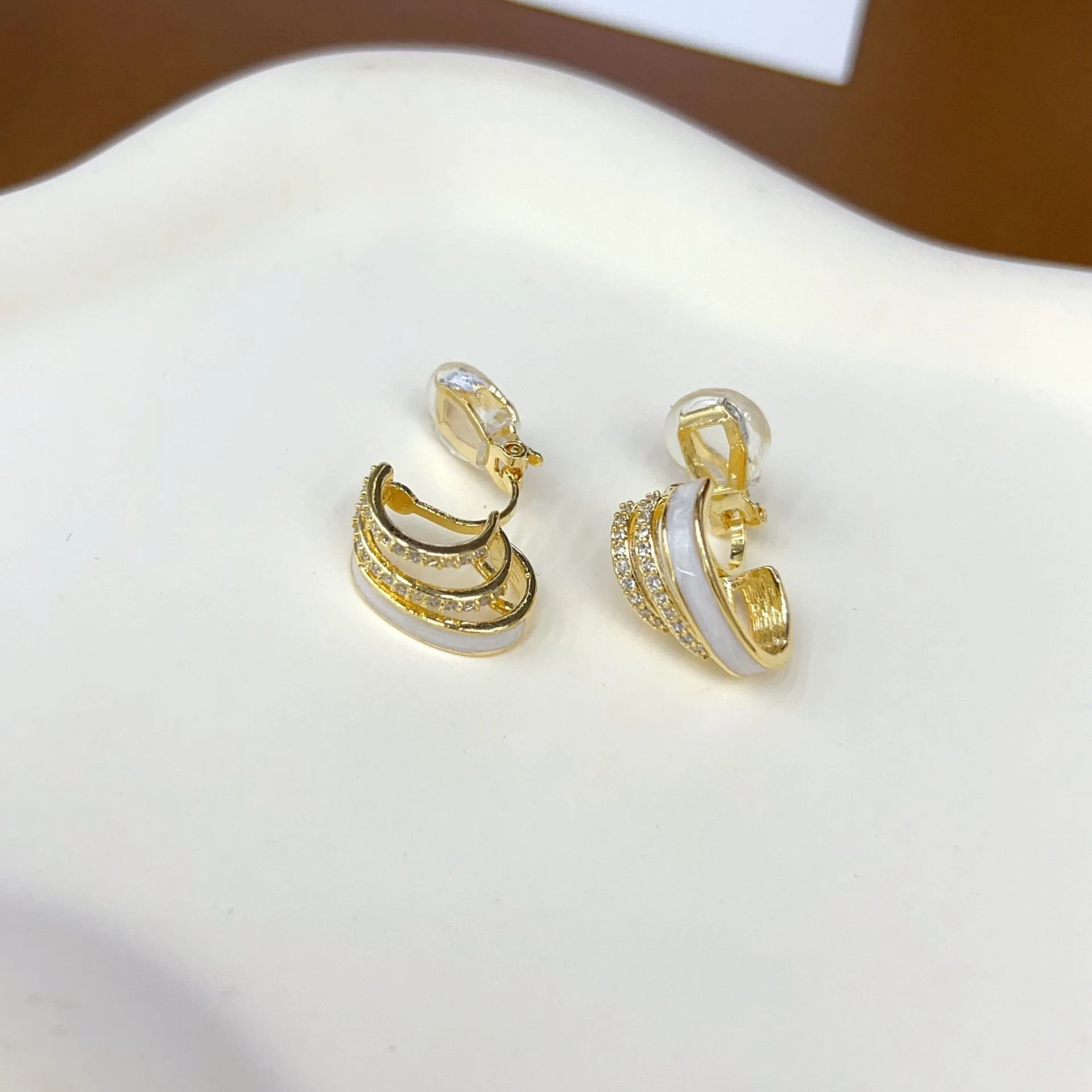 No piercing ear clip red full diamond painting oil stud earrings in geometric shape on woman's earlobe