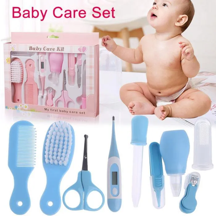 Portable baby health suit 9-piece grooming set in pink with scissors, clippers, comb and thermometer on white background