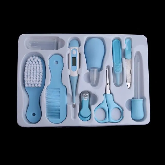 Portable baby health suit 9-piece grooming set in pink with scissors, clippers, comb and thermometer on white background