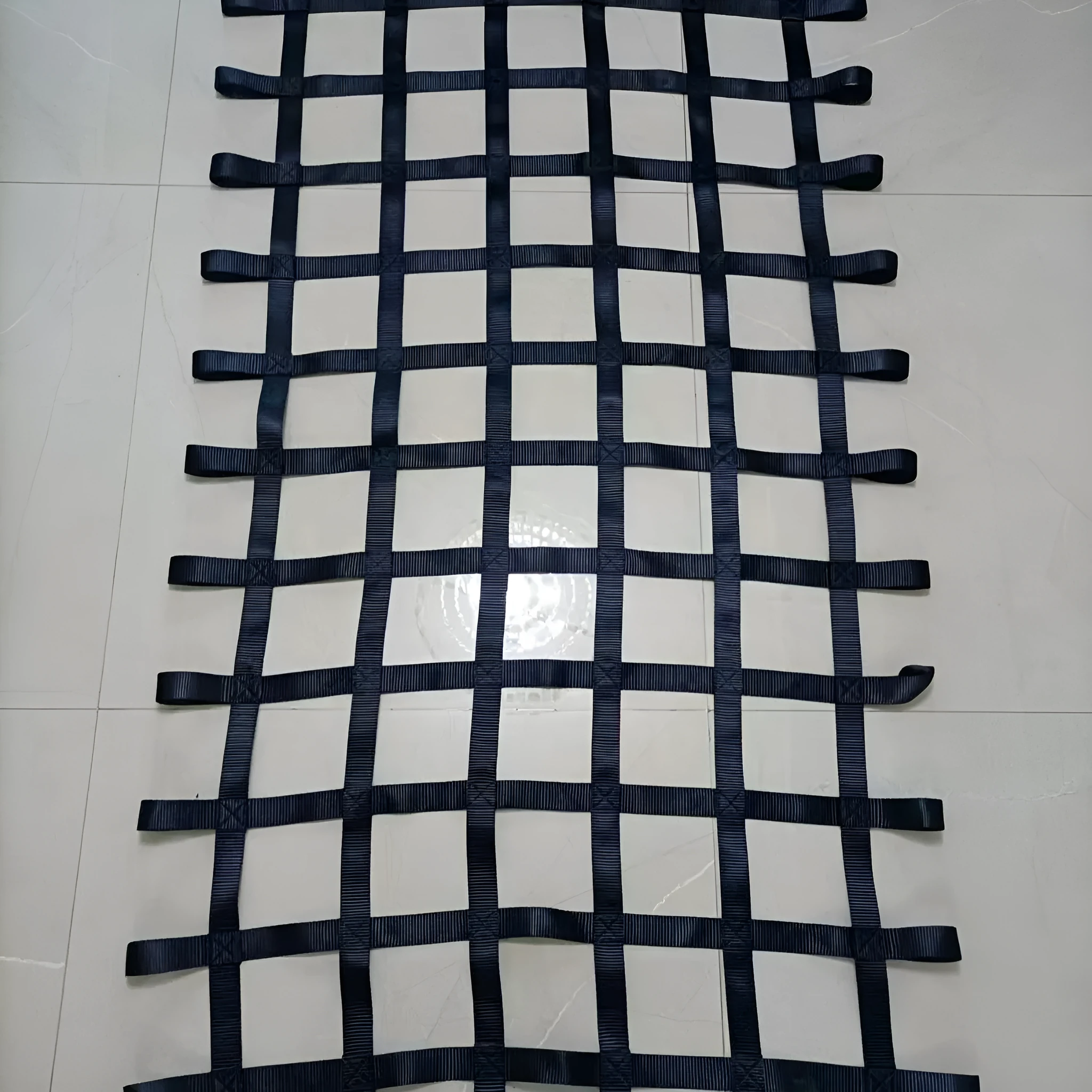 Black polyester ribbon children's climbing net with 1.5 inch wide straps and 5 inch mesh openings